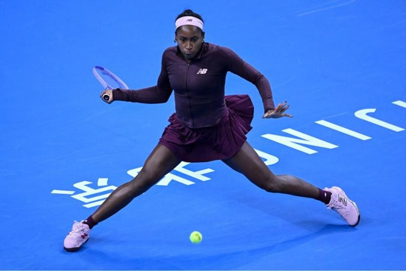 USA's Coco Gauff hits a return to China's Sun Xinran during their women's singles match at the China Open tennis tournament in Beijing on October 5, 2026.  ADEK BERRY / AFP