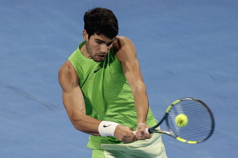 Spain's Carlos Alcaraz hits a return against France's Arthur Fils during their men's singles final match at the Qatar Open tennis tournament in Doha on February 21, 2026.  Karim JAAFAR / AFP