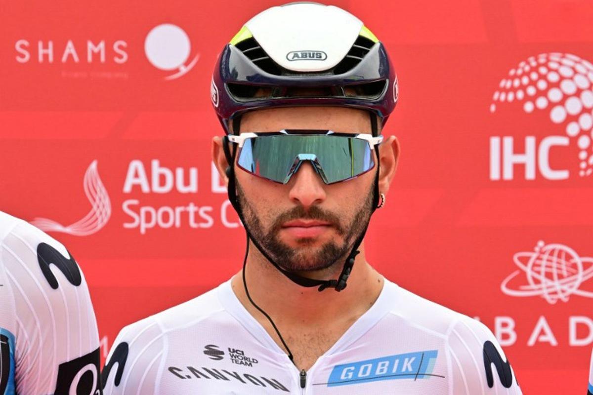 Movistar team's Colombian rider Fernando Gaviria looks on during the first stage of the UAE Tour cycling race from Shams Solar Power Station Madinat Zayed to Liwa Palace in Abu Dhabi on February 17, 2025.  Giuseppe CACACE / AFP