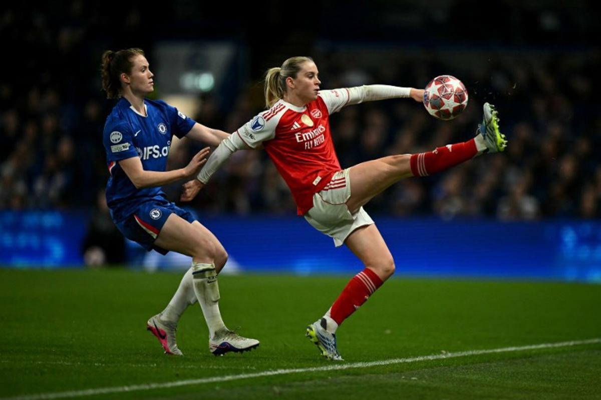 Arsenal's English striker #23 Alessia Russo is put under pressure by Chelsea's Dutch centre-back #05 Veerle Buurman during the UEFA Women's Champions League Quarter Final second-leg football match between Chelsea and Arsenal at Stamford Bridge in London on April 1, 2026.  Ben STANSALL / AFP