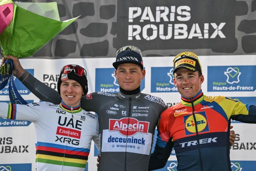 Second placed UAE Team Emirate's Slovenian rider Tadej Pogacar (L), First placed Alpecin-Deceuninck's Dutch rider Mathieu van der Poel and Third placed Lidl-Trek's Danish rider Mads Pedersen celebrate on the podium of the 122nd edition of the Paris-Roubaix one-day classic cycling race, 259,2 km between Compiegne and Roubaix, northern France on April 13, 2025.  Jeff PACHOUD / AFP