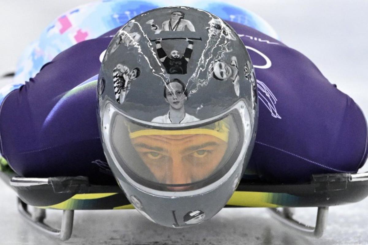 Ukraine's Vladyslav Heraskevych takes part in the skeleton men's training session at Cortina Sliding Centre during the Milano Cortina 2026 Winter Olympic Games in Cortina d'Ampezzo on February 11, 2026.  Tiziana FABI / AFP