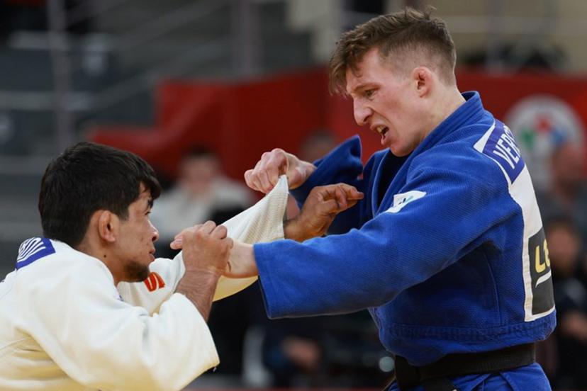 Uzbekistan's Samariddin Kuchkarov (white) competes against Belgium's Jorre Verstraeten in the men's under 60 kg bronze medal bout at the Tbilisi Grand Slam judo tournament in Tbilisi on March 20, 2026.  Giorgi ARJEVANIDZE / AFP