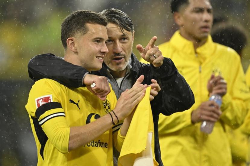 Dortmund's Croatian head coach Niko Kovac celebrates with Dortmund's Greek midfielder #19 Konstantinos Karetsas after the German first division Bundesliga football match between BVB Borussia Dortmund and Hamburg SV in Dortmund, western Germany on August 29, 2026.  INA FASSBENDER / AFP