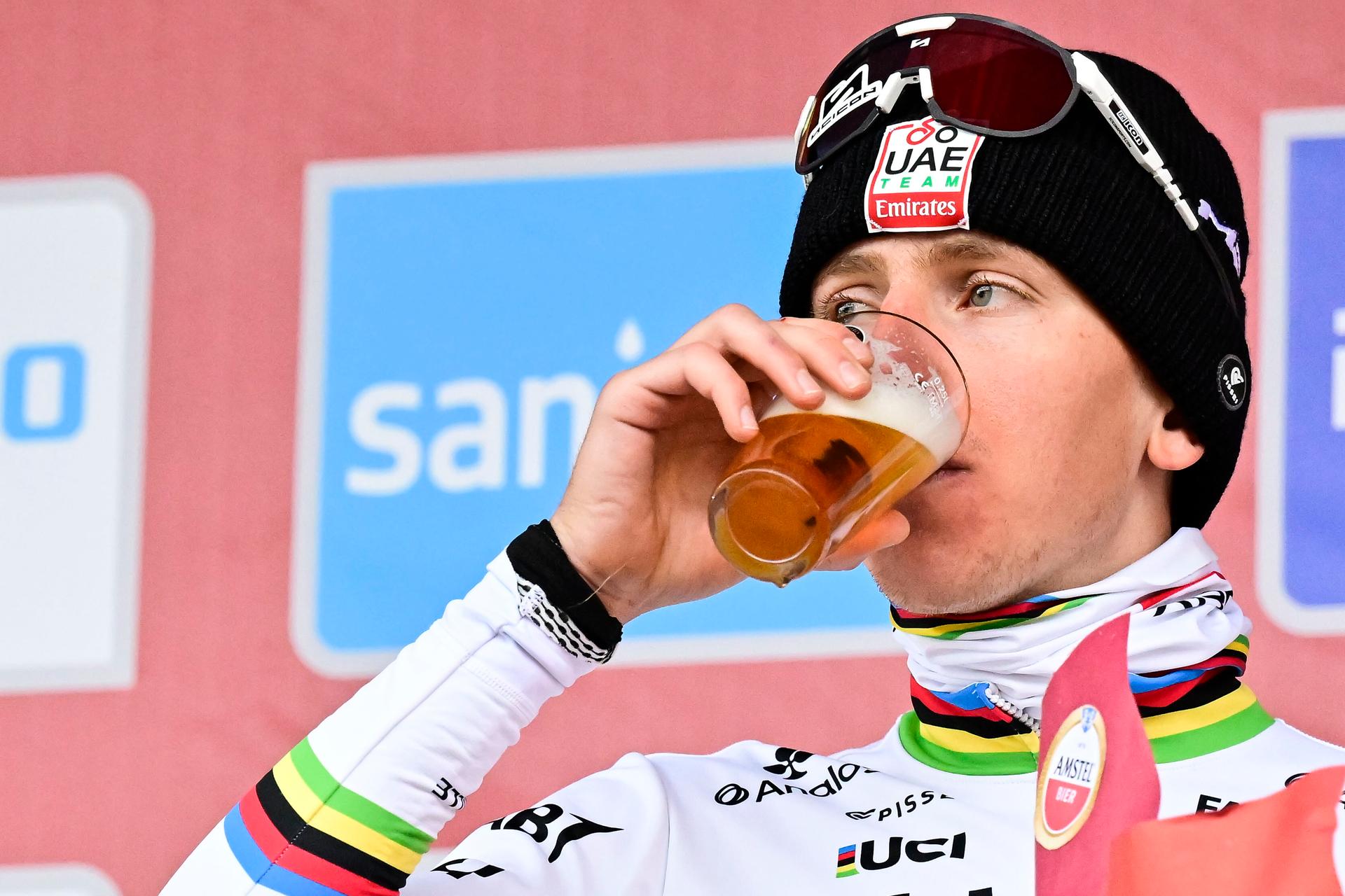 Slovenian Tadej Pogacar of UAE Team Emirates pictured on the podium drinking an Amstel beer after the men elite 'Amstel Gold Race' one day cycling race, 255,9 km from Maastricht to Valkenburg, The Netherlands, Sunday 20 April 2025. BELGA PHOTO DIRK WAEM