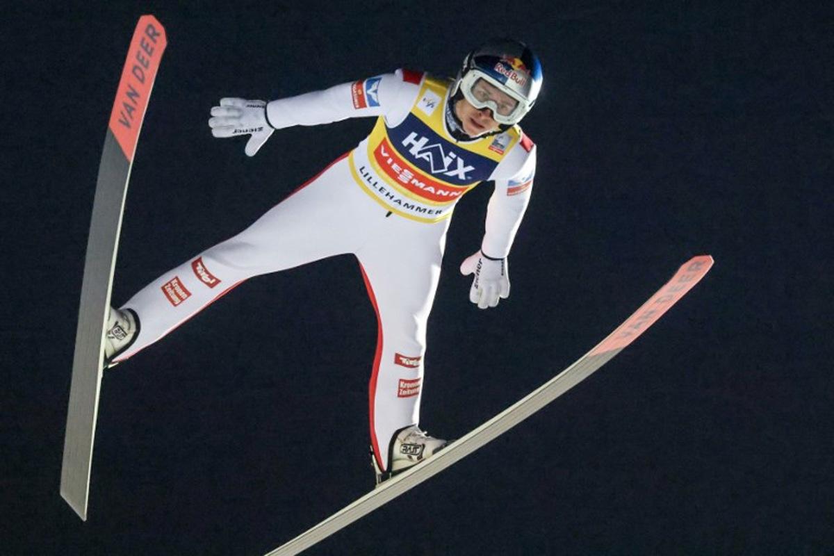 Austria's Daniel Tschofenig soars through the air during the Men's Large Hill HS140 competition of the FIS Ski Jumping World Cup in Lillehammer, Norway on November 23, 2025.  Geir Olsen / NTB / AFP