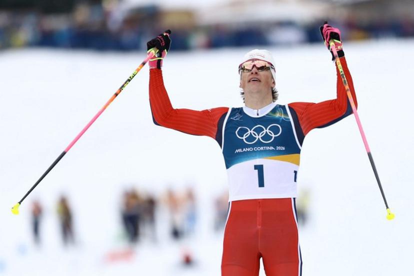 Norway's Johannes Hoesflot Klaebo celebrates as he crosses the finish line to win the men's cross country sprint classic final event of the Milano Cortina 2026 Winter Olympic Games at Tesero Cross-Country Skiing Stadium in Lago di Tesero (Val di Fiemme), on February 10, 2026.  Anne-Christine POUJOULAT / AFP