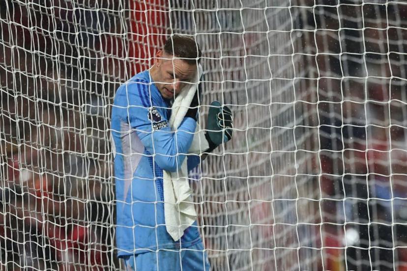 Nottingham Forest's Belgian goalkeeper #26 Matz Sels wips the rain from his face during the English Premier League football match between Nottingham Forest and Brentford at The City Ground in Nottingham, central England, on May 1, 2025.  Darren Staples / AFP