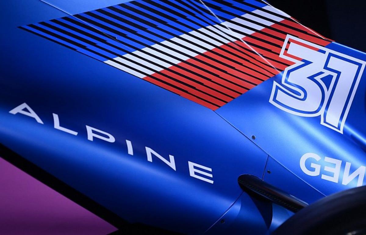 A picture taken at the Palais de Tokyo, in Paris on February 21, 2022, shows a view of the Alpine F1 team's A522 new racing car for the upcoming Formula One 2022 season, unveiled two days before the first pre-season track session of the year at the Circuit de Barcelona-Catalunya.  The A522 will be raced this year by Fernando Alonso and Esteban Ocon, who'll team up for a second season at Alpine.   FRANCK FIFE / AFP
