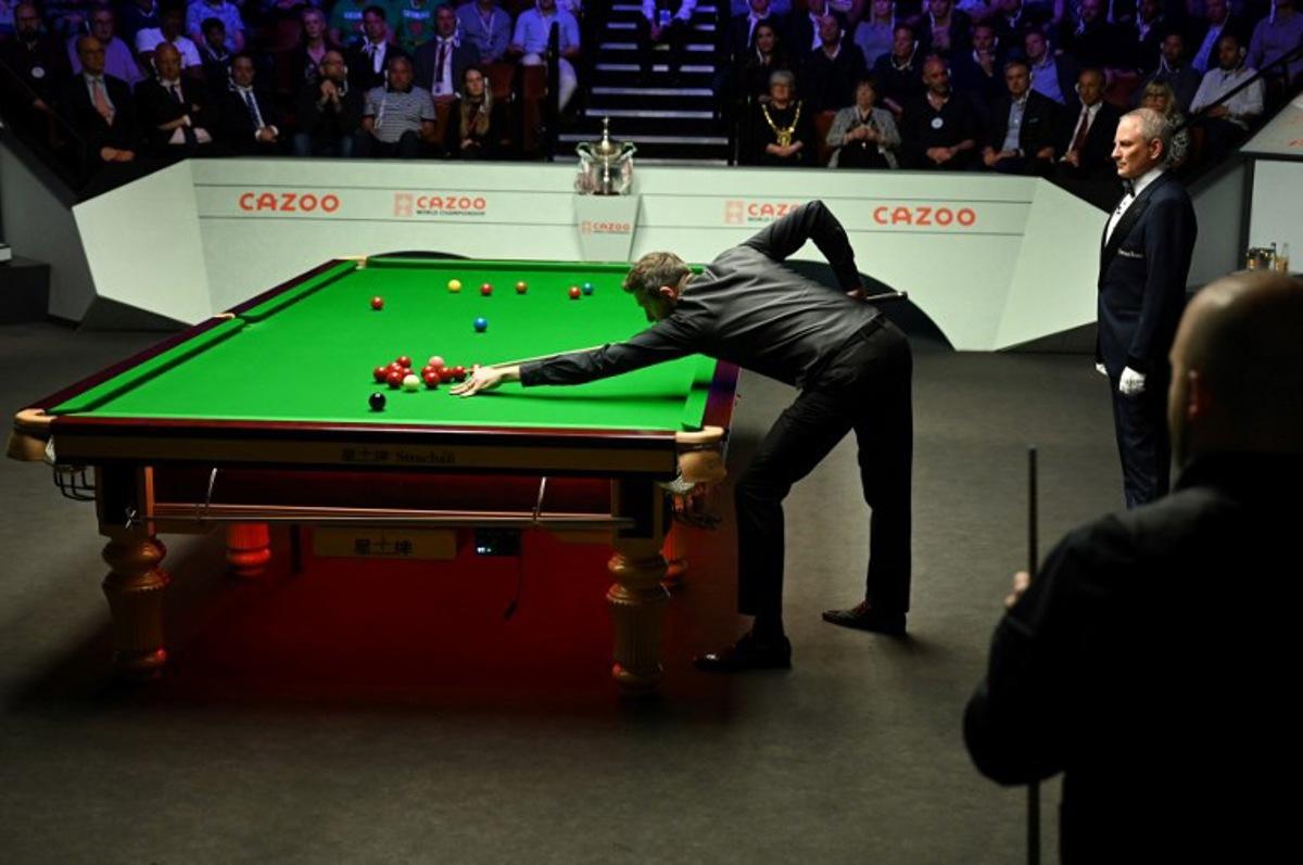 England's Mark Selby plays a shot against Belgium's Luca Brecel during the evening session on day two of their World Championship Snooker final match at The Crucible in Sheffield, northern England on May 1, 2023.   Oli SCARFF / AFP