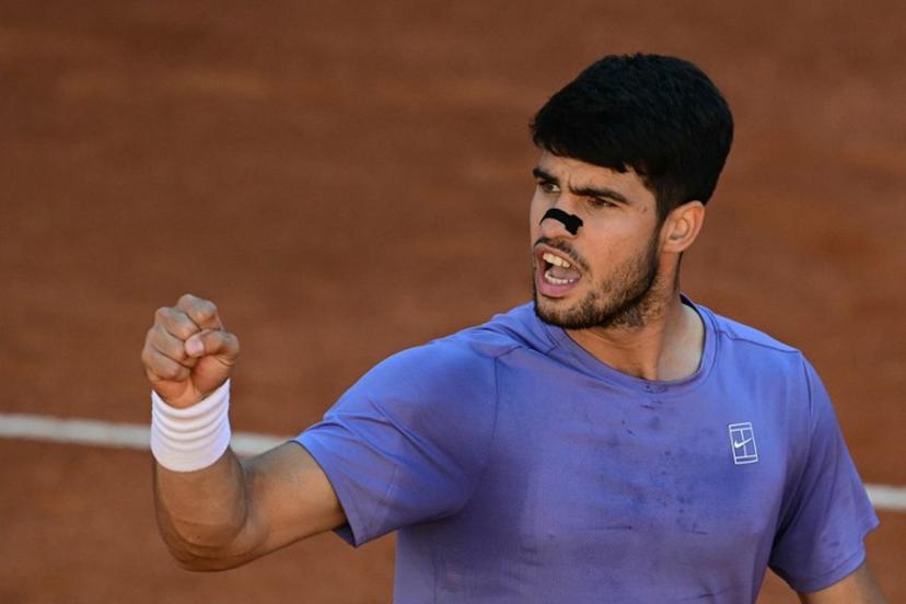 Spain's Carlos Alcaraz celebrates his victory during his men's singles semi-final match against Italy's Lorenzo Musetti for the ATP Rome Open tennis tournament at Foro Italico in Rome on May 16, 2025.   Tiziana FABI / AFP
