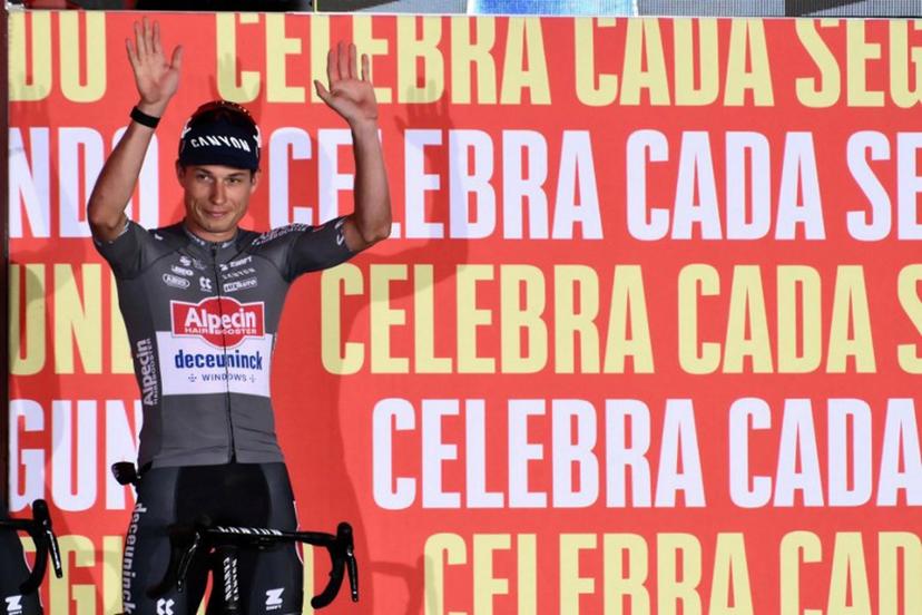 Team Alpecin's Belgian rider Jasper Philipsen waves during the official teams presentation of the 80th edition of 'La Vuelta' cycling tour of Spain, in Torino, Italy on August 21, 2025.  Marco BERTORELLO / AFP