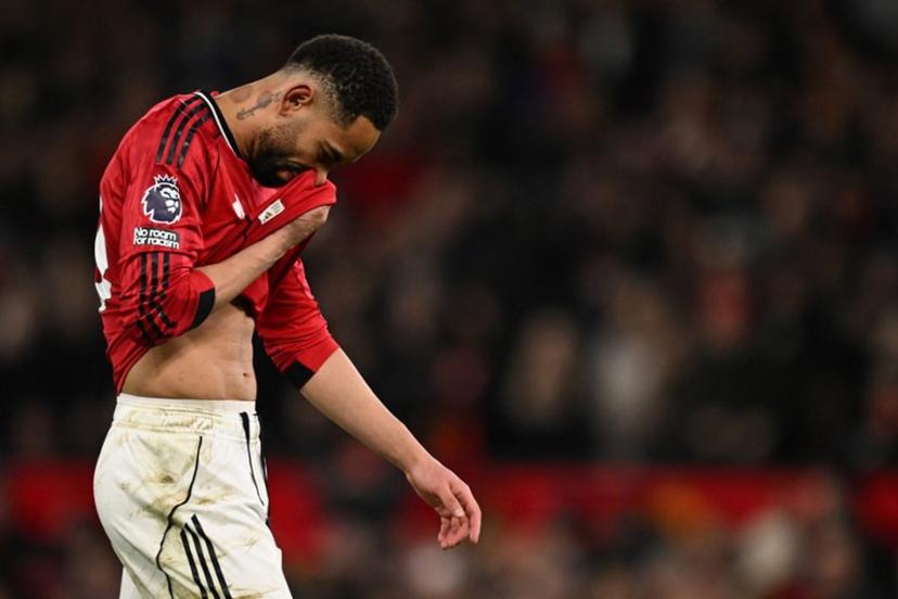 Manchester United's Brazilian striker #10 Matheus Cunha reacts during the English Premier League football match between Manchester United and Bournemouth at Old Trafford in Manchester, north west England, on December 15, 2025.  PETER POWELL / AFP
