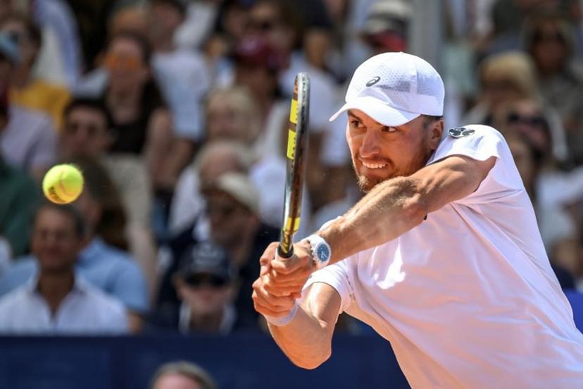 Belgium's Raphael Collignon returns the ball to Greece's Stefanos Tsitsipas during their men's singles final match at the Swiss Open tennis tournament in Gstaad, on July 19, 2026.  Fabrice COFFRINI / AFP
