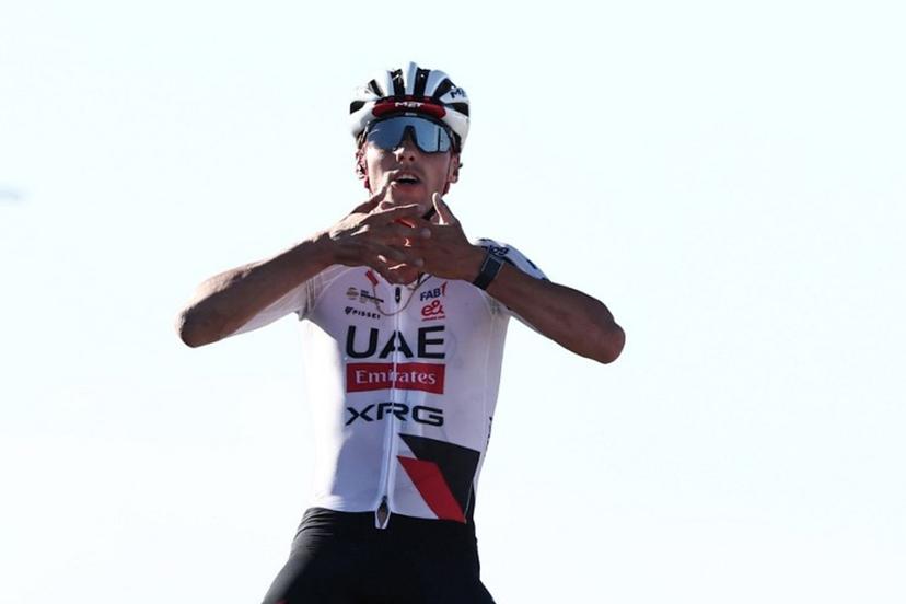 UAE Team Emirates XRG Switzerland's Jan Christen celebrates his victory as he crosses the finish line of the fifth and last stage of the AlUla Tour cycling race, 163.9km from Alula Old Town to Skyviews of Harrat Uwayrid on January 31, 2026.  Anne-Christine POUJOULAT / AFP