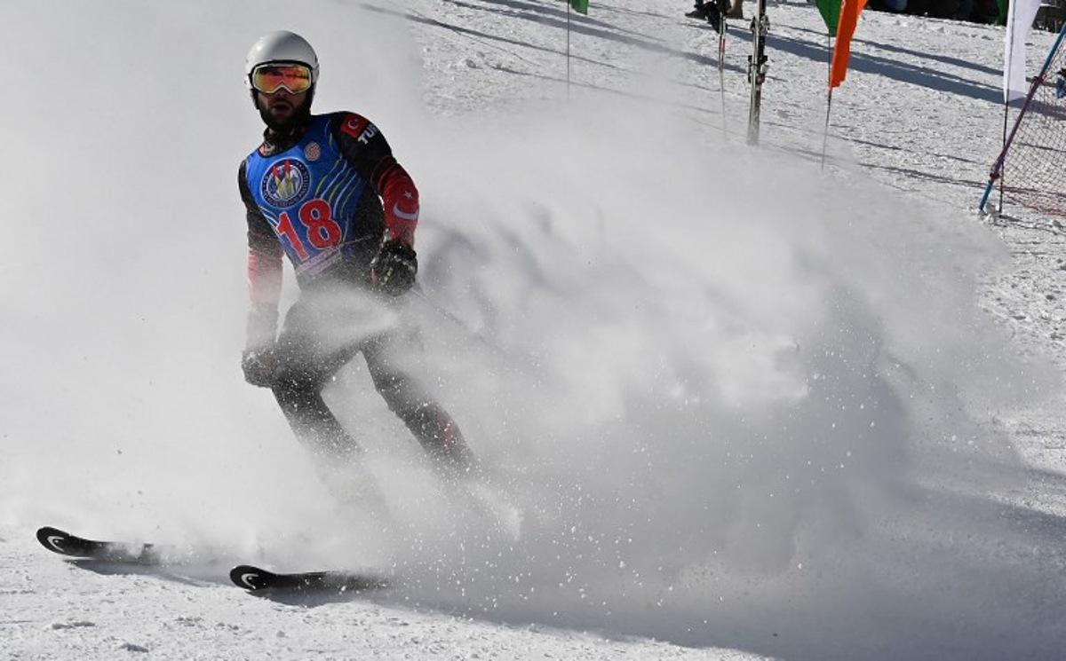 In this picture taken on January 29, 2019, Turkish skier Berkin Usta takes part in the CAS Karakoram International Alpine Ski Cup, at the Pakistan Air Force-owned and operated Naltar Ski Resort, some 25km north of Gilgit in Pakistan's remote mountainous north. Dozens of skiers in late January took part in a rare international competition in Pakistan, which boasts some of the world's highest mountains but remains off-piste for most winter sportsmen due to years of insecurity and lack of infrastructure. The Naltar Ski Resort in the Karakoram mountain range where the competition took place is at the heart of Pakistan's attempts to build up its winter sports tourism industry. AAMIR QURESHI / AFP