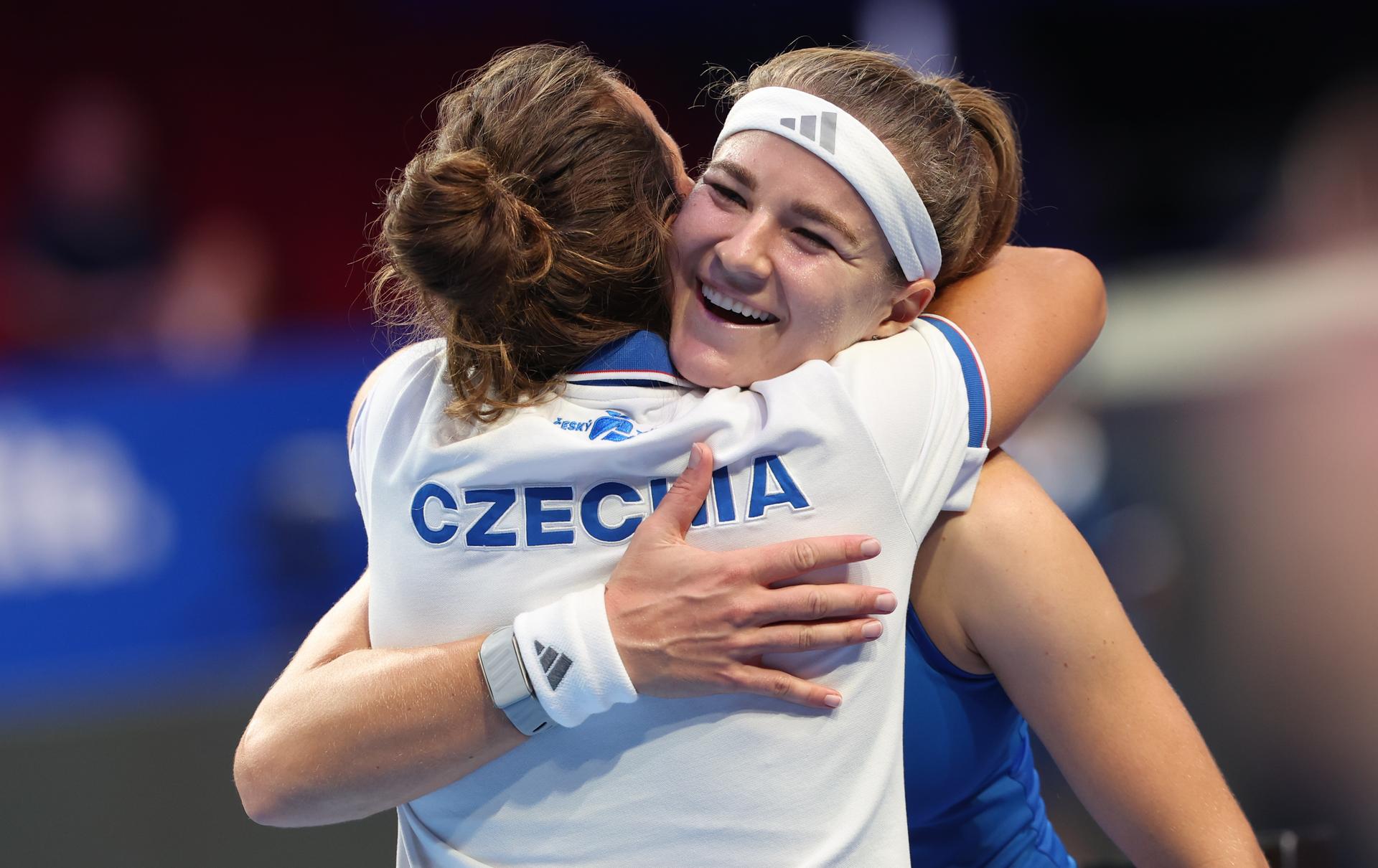 Czech Karolina Muchova and Barbora Strycova celebrate after winning the tennis match between Jessica Bouzas Maneiro of Spain and  Karolína Muchová of Czech Republic in the Semi Finals of the Billie King Cup tournament, on Friday 25 September 2026 in Shenzhen, China. BELGA PHOTO VIRGINIE LEFOUR