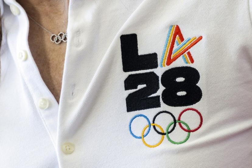 LA28 (Los Angeles 2028) chief athlete officer and former US swimmer Janet Evans speaks with journalists during the event celebrating the arrival of the Olympic flag at Los Angeles International Airport (LAX) in Los Angeles, on August 12, 2024.  Los Angeles will host the 2028 Summer Olympic Games. The arrival marks the official Olympic Flag's return to Los Angeles for the first time in 40 years. Etienne LAURENT / AFP