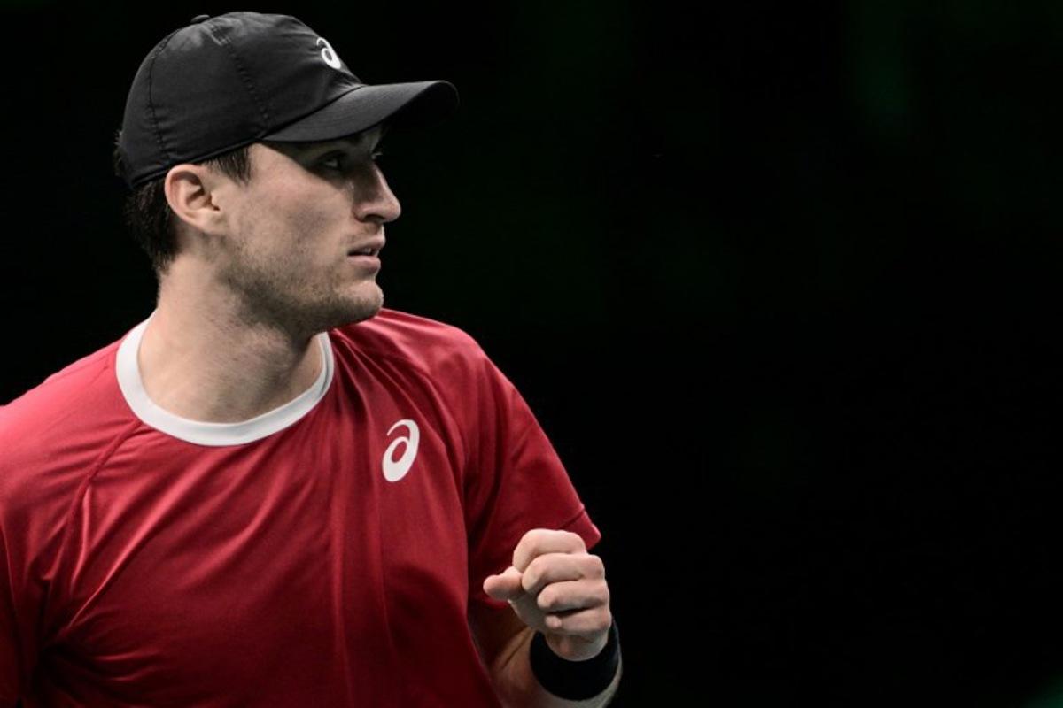Belgium's Raphael Collignon reacts as he plays against France's Corentin Moutet during their Davis Cup men's singles quarter finals tennis match, at the Super Tennis Arena, in Bologna, northen Italy, on November 18, 2025.  Tiziana FABI / AFP