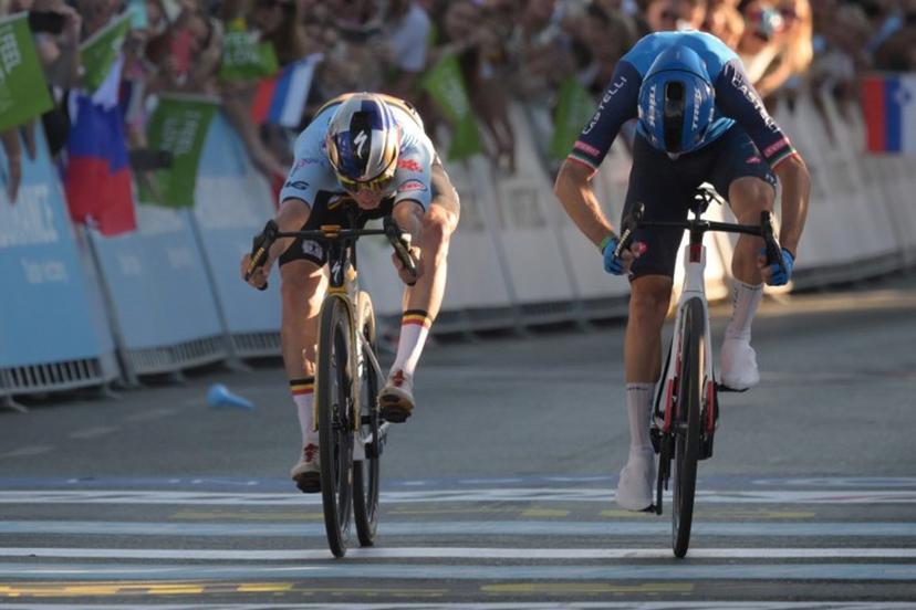 Belgium's rider Remco Evenepoel (L) crosses the finish line to win ahead of Italy's rider Giulio Ciccone the men's elite road race of the UEC European Road Cycling Championships in Sencur, near Ljubljana, Slovenia, on October 4, 2026.  JURE MAKOVEC / AFP