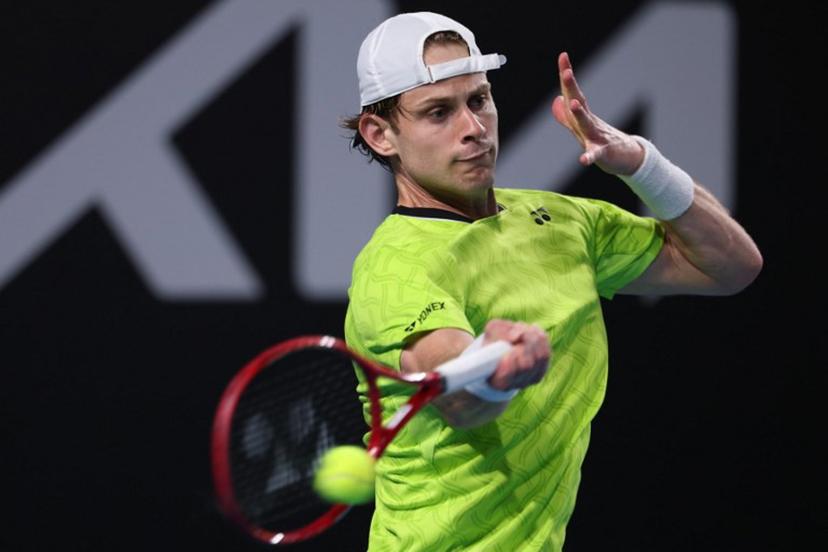 Belgium's Zizou Bergs hits a shot against Poland's Hubert Hurkacz during their men's singles match on day three of the Australian Open tennis tournament in Melbourne on January 20, 2026.  IZHAR KHAN / AFP