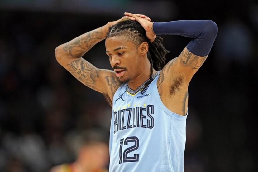 (FILES) Ja Morant #12 of the Memphis Grizzlies reacts during the first half against the Phoenix Suns at FedExForum on March 10, 2025 in Memphis, Tennessee. NOTE TO USER: User expressly acknowledges and agrees that, by downloading and or using this photograph, User is consenting to the terms and conditions of the Getty Images License Agreement.  The NBA took aim at Morant's imaginary gun gesture on April 4, 2025, fining him $75,000 after he used it to celebrate a basket for the second time in a week. Justin Ford / GETTY IMAGES NORTH AMERICA / AFP