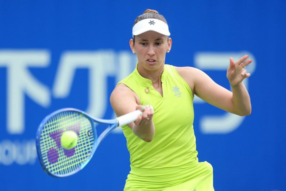 Belgium's Elise Mertens hits a return against Czech Republic's Tereza Valentova during their women's singles match at the Japan Open tennis tournament in Osaka on October 16, 2025.  PAUL MILLER / AFP