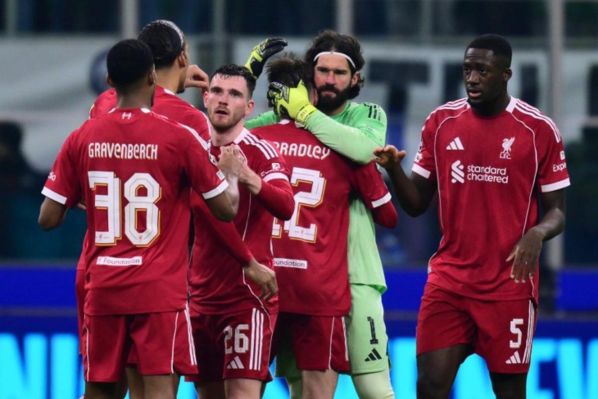 Liverpools players celebrate after winning the UEFA Champions League phase day 6 football match between Inter Milan and Liverpool at San Siro stadium in Milan, on December 9, 2025.   Stefano RELLANDINI / AFP