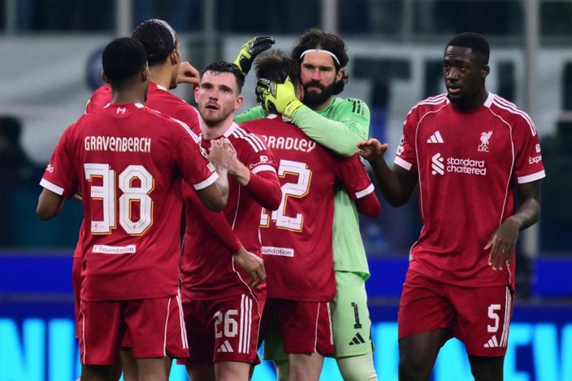 Liverpools players celebrate after winning the UEFA Champions League phase day 6 football match between Inter Milan and Liverpool at San Siro stadium in Milan, on December 9, 2025.   Stefano RELLANDINI / AFP