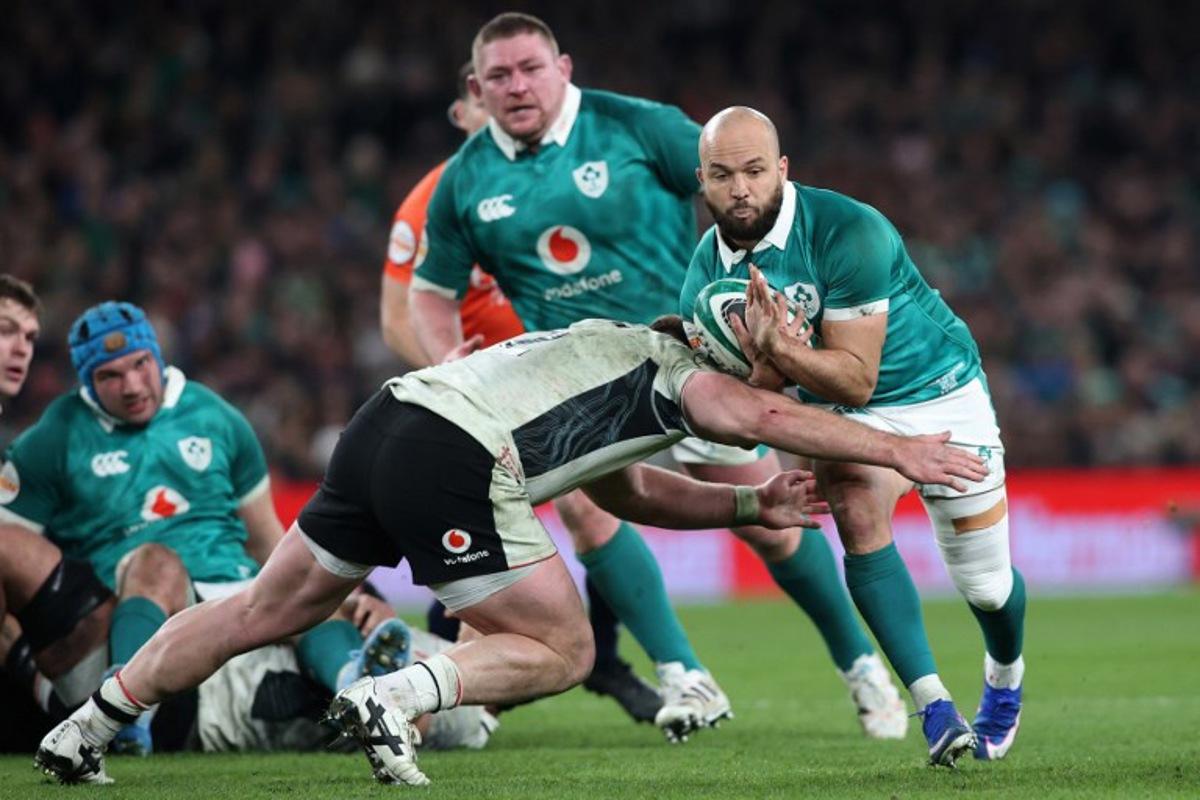Ireland's scrum-half Jamison Gibson-Park is tackled during the Six Nations international rugby union match between Ireland and Wales at the Aviva Stadium in Dublin, on March 6, 2026.  Paul Faith / AFP