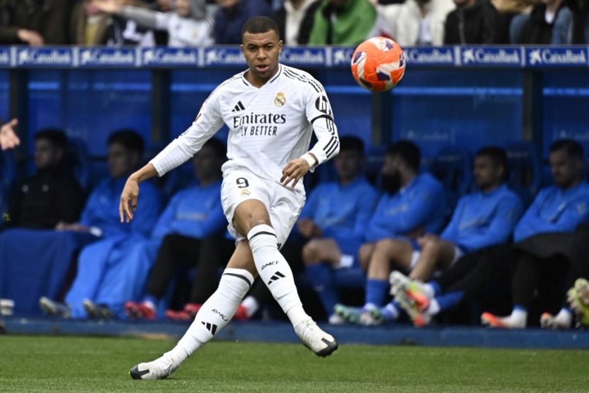 Real Madrid's French forward #09 Kylian Mbappe kicks the ball during the Spanish league football match between Deportivo Alaves and Real Madrid CF at the Mendizorroza stadium in Vitoria on April 13, 2025.  ANDER GILLENEA / AFP