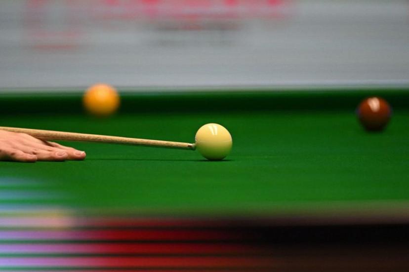 England's Judd Trump plays a shot during the Masters snooker tournament final against Wales' Mark Williams at Alexandra Palace in London on January 15, 2023.  JUSTIN TALLIS / AFP
