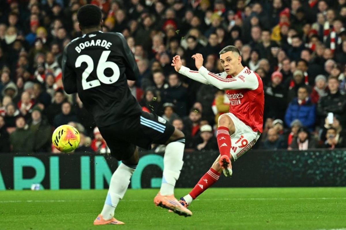Arsenal's Belgian midfielder #19 Leandro Trossard shoots but fails to score during the English Premier League football match between Arsenal and Aston Villa at the Emirates Stadium in London on December 30, 2025.   Ben STANSALL / AFP