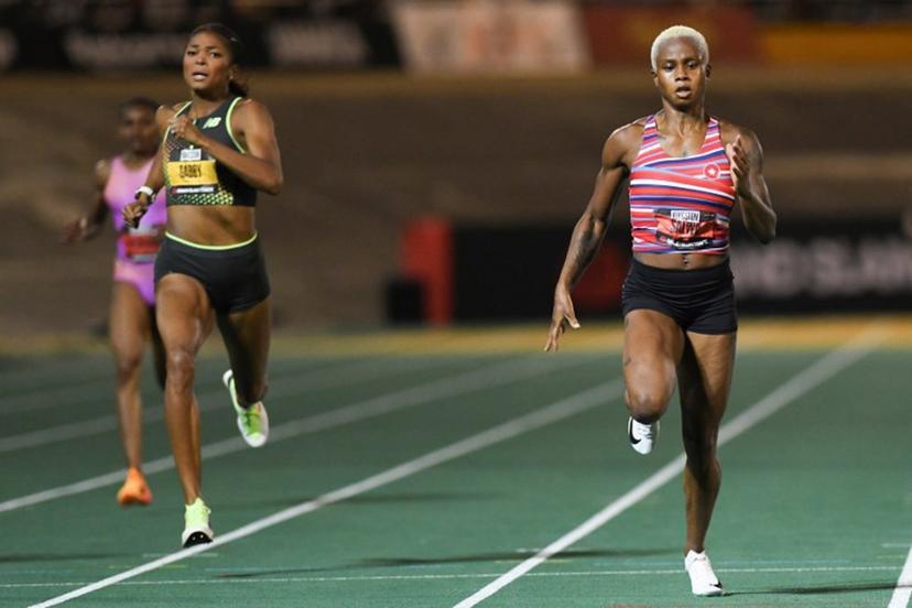 Bahrain's Salwa Eid Naser (R) comes in first ahead of USA's Gabby Thomas during the women's 400m event during the Grand Slam Track competition at the National Stadium in Kingston, Jamaica, on April 5, 2025.  Ricardo Makyn / AFP