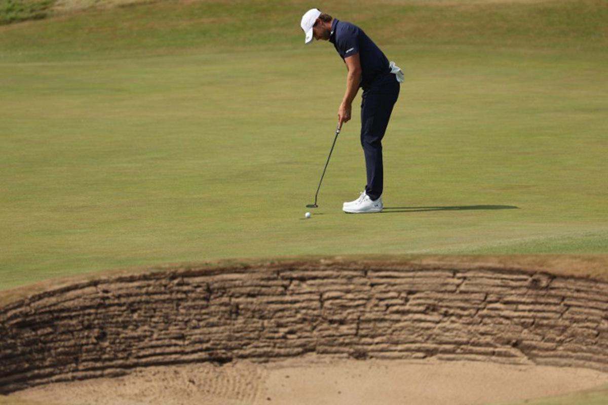 Belgium's Thomas Detry putts on the 1st green on day three of the 154th Open Golf championship at Royal Birkdale Golf Club near Southport in north-west England on July 18, 2026.  Adrian Dennis / AFP