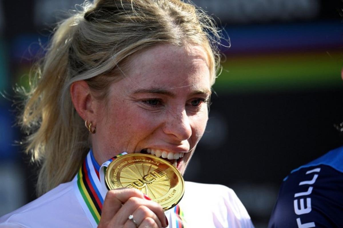First-placed Demi Vollering of the Netherlands poses on the podium after the Women's Elite Road Race at the 2026 Union Cycliste Internationale (UCI) Road World Championships in Montreal, Quebec, on September 26, 2026.  Andrej Ivanov / AFP