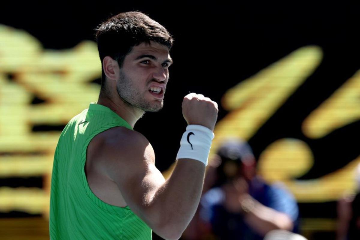 Spain's Carlos Alcaraz celebrates victory over France's Corentin Moutet after their men's singles match on day six of the Australian Open tennis tournament in Melbourne on January 23, 2026.  DAVID GRAY / AFP