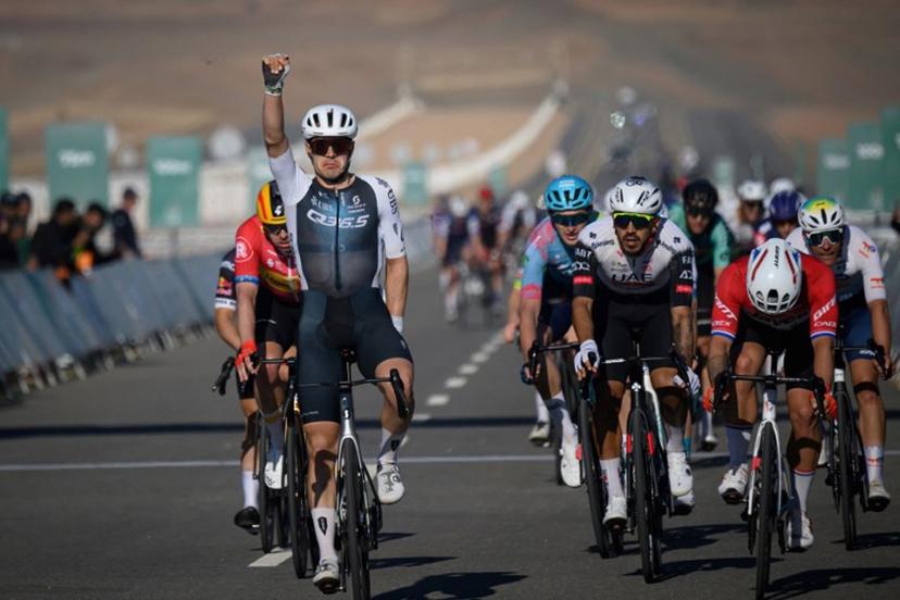 Q36.5 Pro Cycling Team's Italian rider Matteo Moschetti (L) celebrates his victory as he crosses the finish line of the fifth stage of the the Alula Tour cycling race in Alula on February 1, 2025.  Loic VENANCE / AFP