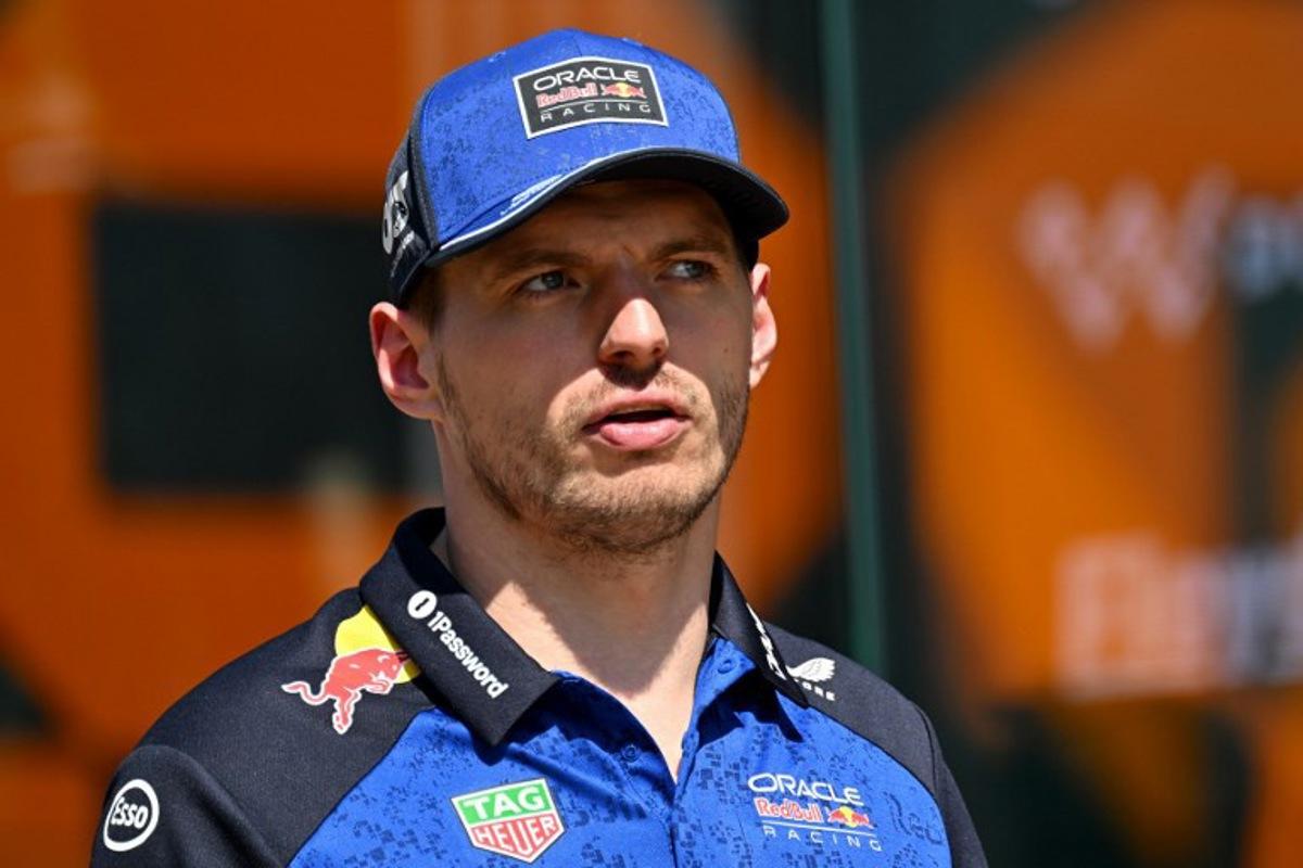 Red Bull Racing's Dutch driver Max Verstappen walks down the paddock ahead of the Formula One British Grand Prix at the Silverstone motor racing circuit in Silverstone, central England, on July 2, 2026.  Andrej ISAKOVIC / AFP