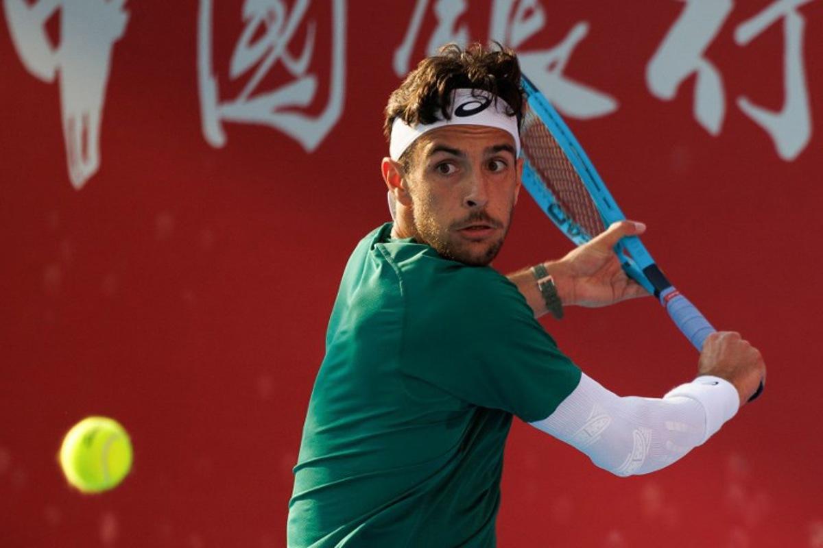 Italy's Lorenzo Musetti hits a return against Russia's Andrey Rublev during their men's singles semi-final match at the Hong Kong Tennis Open in Hong Kong on January 10, 2026.  May JAMES / AFP