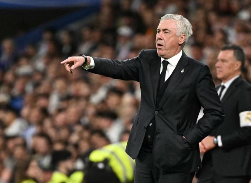 Real Madrid's Italian coach Carlo Ancelotti gestures on the touchline during the Spanish Copa del Rey (King's Cup) semi-final second leg football match between Real Madrid CF and Real Sociedad at the Santiago Bernabeu stadium in Madrid on April 1, 2025.  JAVIER SORIANO / AFP