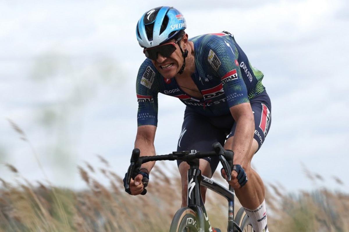 Soudal Quick-Step's Belgian rider Jasper Stuyven cycles on a cobblestone sector during the 123rd edition of the Paris-Roubaix one-day classic cycling race, 258.3 km between Compiègne and Roubaix, northern France, on April 12, 2026.   Anne-Christine POUJOULAT / AFP