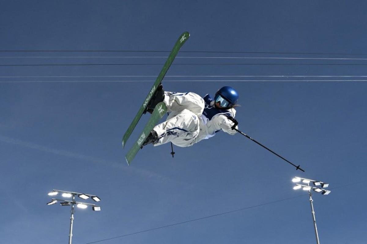 China's Gu Ailing Eileen competes in the freestyle skiing women's freeski halfpipe final run 2 during the Milano Cortina 2026 Winter Olympic Games at Livigno Snow Park, in Livigno (Valtellina), on February 22, 2026.  Jeff PACHOUD / AFP