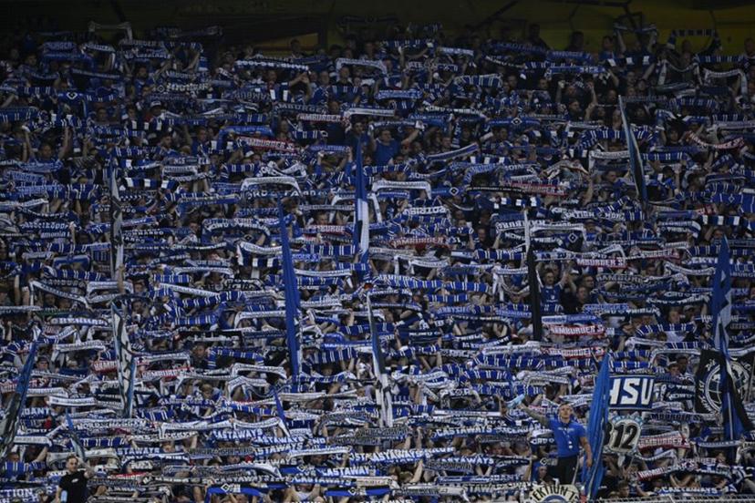 Hamburg SV fans cheer their team during the German first division Bundesliga football match between BVB Borussia Dortmund and Hamburg SV in Dortmund, western Germany on August 29, 2026.  INA FASSBENDER / AFP