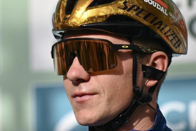 Soudal Quick-Step team's Belgian rider Remco Evenepoel looks on from the presentation podium before the start of 118th edition of the Giro di Lombardia (Tour of Lombardy), a 252km cycling race from Bergamo to Como on October 12, 2024.  Marco BERTORELLO / AFP