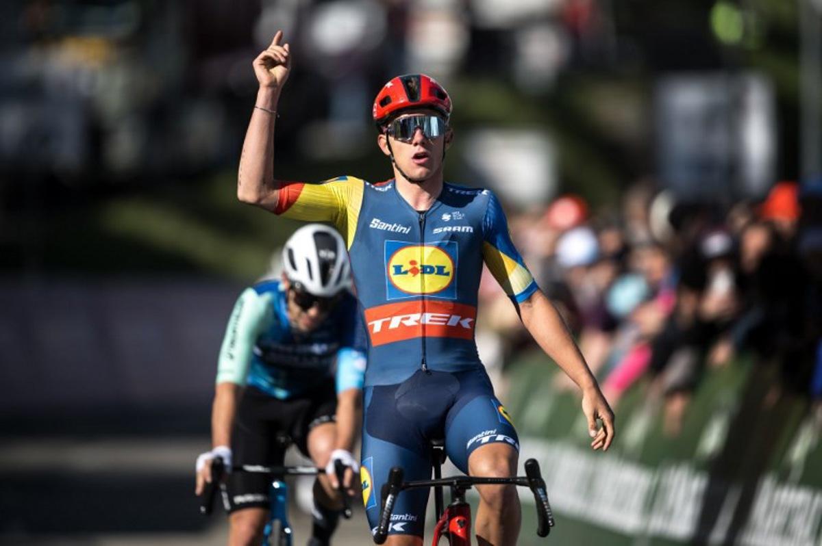 Team Lidl-Trek's Belgian rider Thibau Nys celebrates as he crosses the finish line to win ahead of second placed team Decathlon AG2R La Mondiale's Italian Andrea Vendrame, during the second stage of the Tour of Romandy UCI cycling World tour 171 km from Fribourg to Salvan / Les Marecottes on April 25, 2024.  Fabrice COFFRINI / AFP