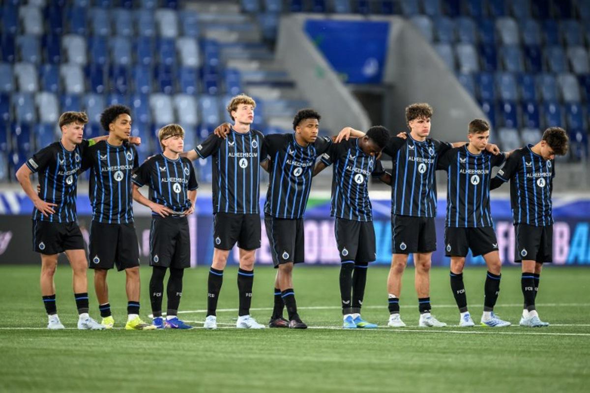 Club Brugge's players look on during the penalty shoot-out during the penalty shoot-out during the UEFA Youth League final football match between Club Brugge and Real Madrid at Stade de la Tuiliere in Lausanne, on April 20, 2026.  Fabrice COFFRINI / AFP
