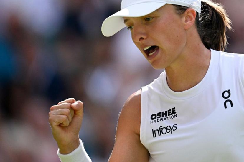 Poland's Iga Swiatek celebrates after winning a point against US player Amanda Anisimova during their women's singles final tennis match on the thirteenth day of the 2025 Wimbledon Championships at The All England Lawn Tennis and Croquet Club in Wimbledon, southwest London, on July 12, 2025.  Kirill KUDRYAVTSEV / AFP