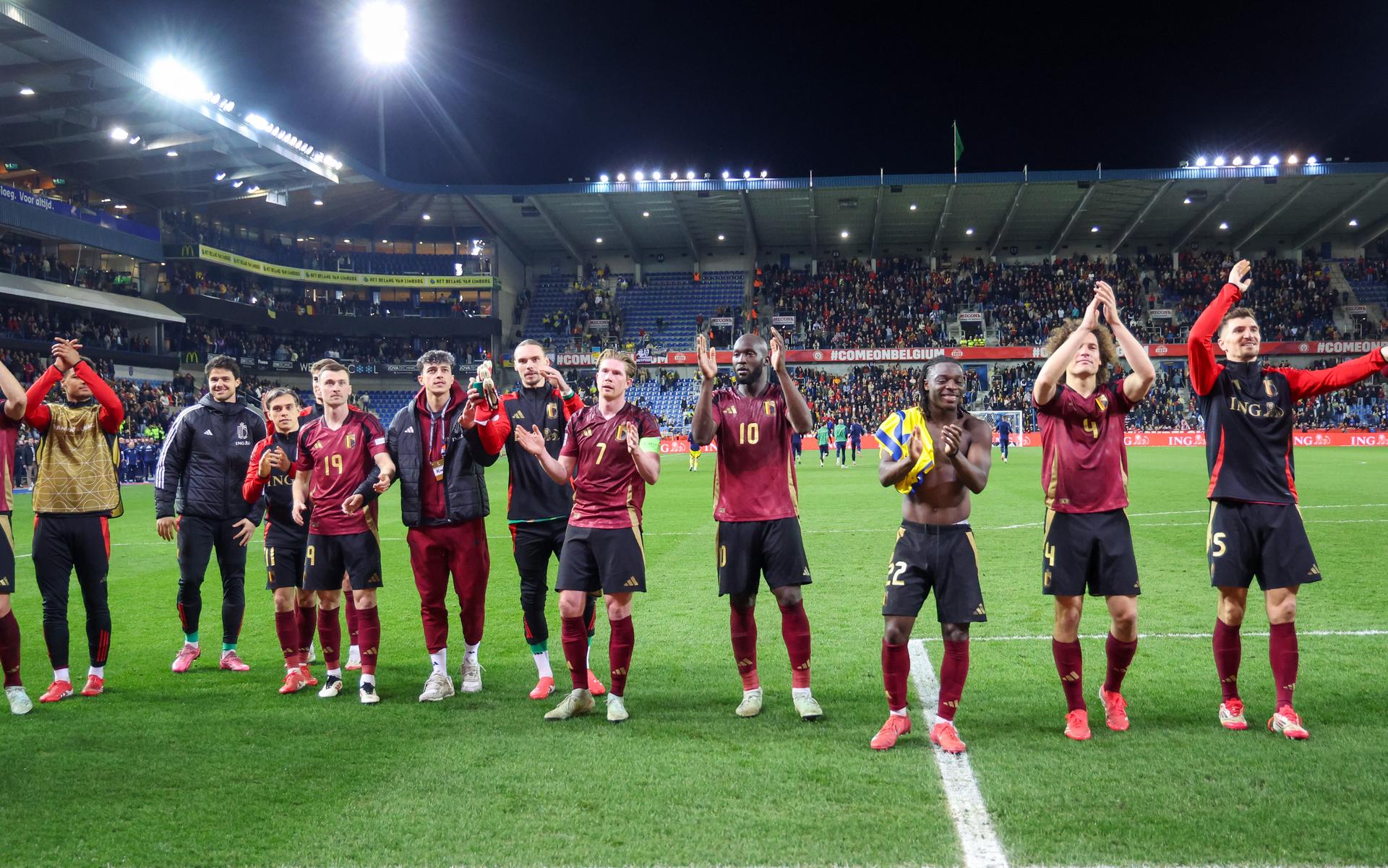 Belgium's players celebrate after winning a soccer game between Belgian national team the Red Devils and Ukraine, Sunday 23 March 2025 in Genk, the return leg of the Nations League playoff. Ukraine won the first leg 3-1. BELGA PHOTO VIRGINIE LEFOUR