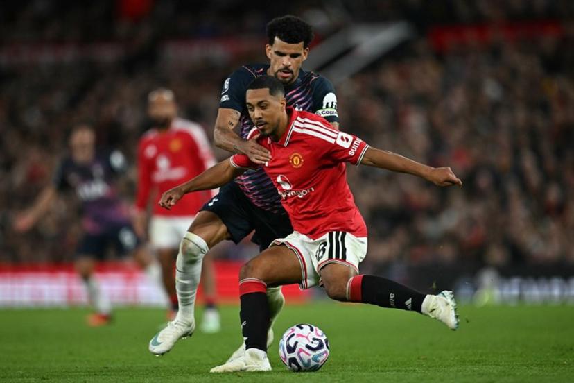 Manchester United's Belgian midfielder #18 Youri Tielemans vies with Tottenham Hotspur's English striker #19 Dominic Solanke during the English Premier League football match between Manchester United and Tottenham Hotspur at Old Trafford in Manchester, north west England, on October 10, 2026.  Paul ELLIS / AFP